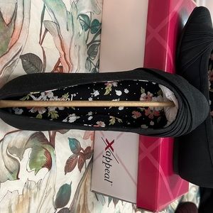 Black ballerina shoes.